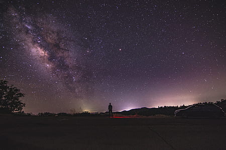 man standing under starry night thumbnail