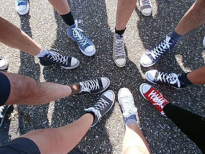 persons showing sneakers thumbnail