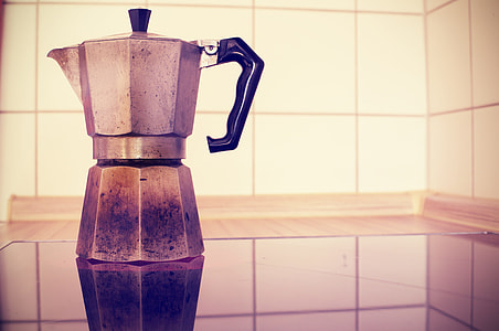 photo of white electric kettle on white tiles thumbnail