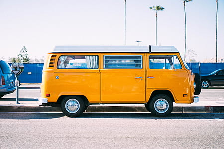yellow van on road during daytime thumbnail