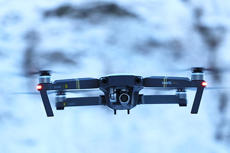 black flying quadcopter thumbnail