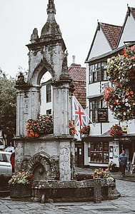 Union Jack flag hanged on gray concrete tower thumbnail