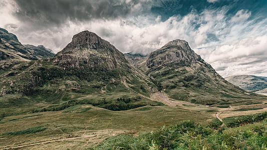 green mountains under white cloudy sky thumbnail