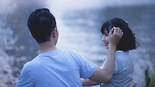 Man and Woman Wearing Shirt Shallow Focus Photography thumbnail