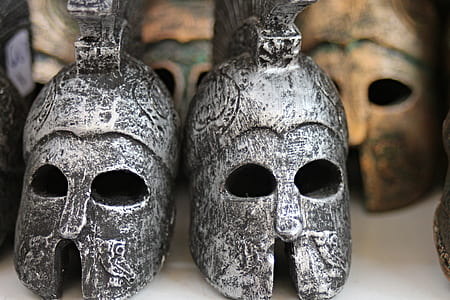 selective focus photography of two gladiator helmets thumbnail