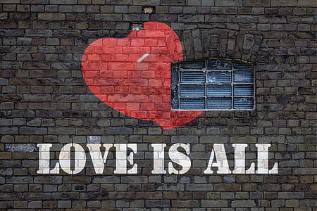 LOVE IS ALL painted brick wall thumbnail
