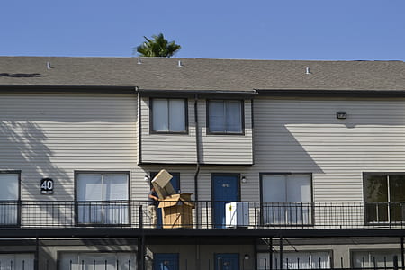 photo of white concrete building under clear blue sky at daytime thumbnail