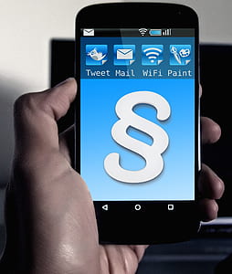 person holding smartphone showing smartphone homescreen thumbnail