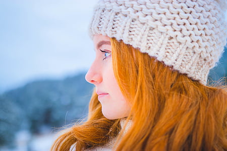 woman wearing knit cap looking sideways closeup photography thumbnail