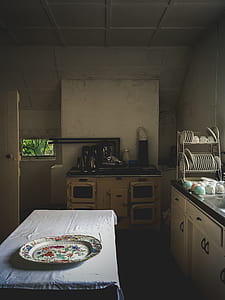 brown wooden cabinet near table thumbnail