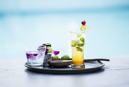 selective focus photography of lime juice filled pint glass on tray thumbnail