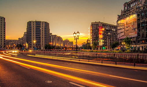 time-lapse photography of cars at the city during sunset thumbnail