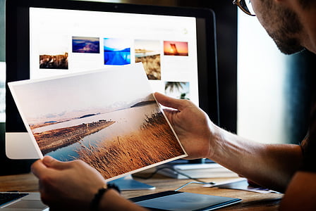 person holding photo of river thumbnail