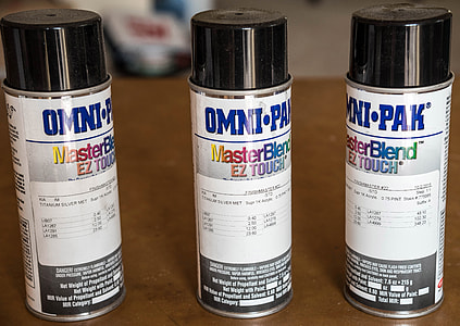 Three spray paint cans thumbnail