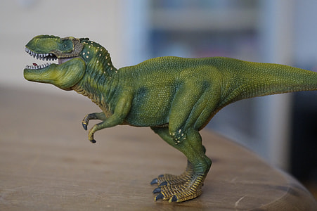 green plastic dinosaur toy thumbnail
