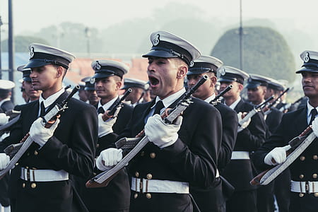 man holding gun while commanding the others thumbnail