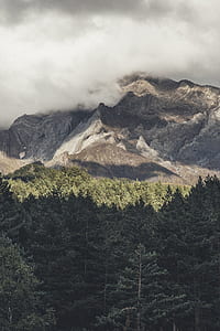 mountain under cloudy sky thumbnail