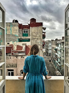 woman standing on balcony thumbnail