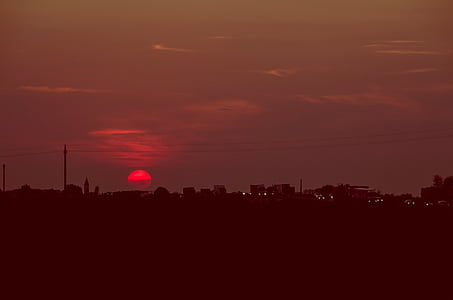 silhouette of house at sunset thumbnail