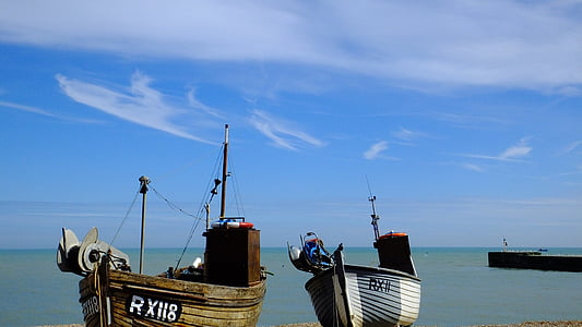 docking two white and brown boat during daytime thumbnail