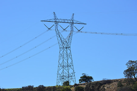 gray electric tower on hills thumbnail