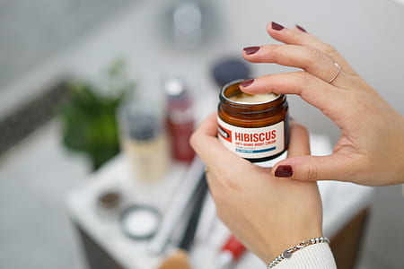 person applying a jar of cream thumbnail
