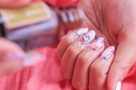 person in pink nail polish thumbnail