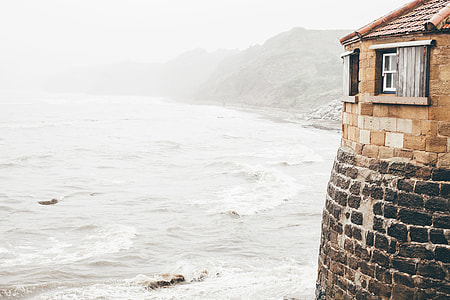 beige concrete house near the beach thumbnail