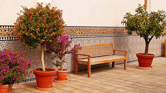 brown wooden bench in front of brown painted wall thumbnail
