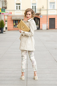 women's holding brass bag thumbnail