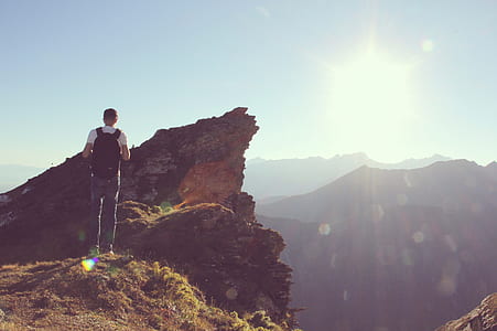 man carrying black backpack thumbnail