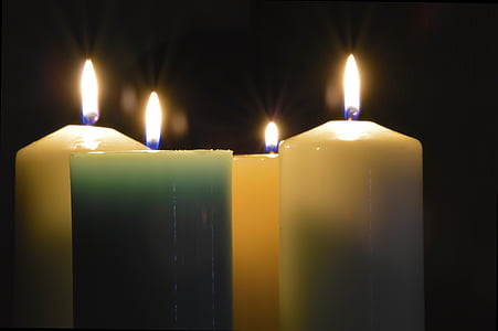 white and green lighted pillar candles thumbnail