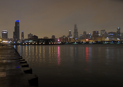 high-rise concrete buildings near body of water thumbnail