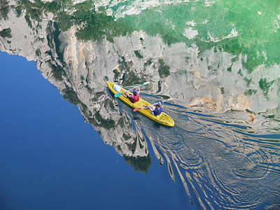 two person riding on yellow kayak during daytime thumbnail