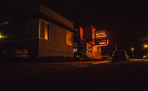car beside Ocean Park Motel during nighttime thumbnail