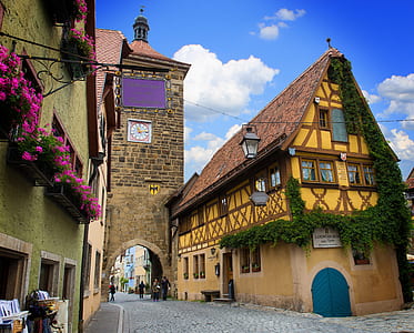 yellow house beside clock tower thumbnail