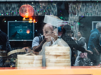 people inside the room viewed from glass window thumbnail