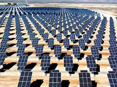 solar panel lot on brown field during daytime thumbnail