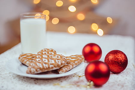 three white pastries beside red baubles thumbnail