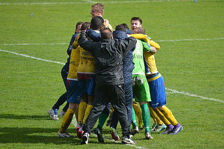 soccer players group hugging thumbnail