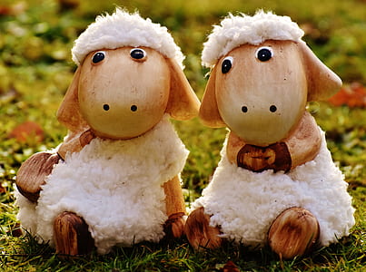 two white Shawn the Sheep figurine on green grass at daytime thumbnail