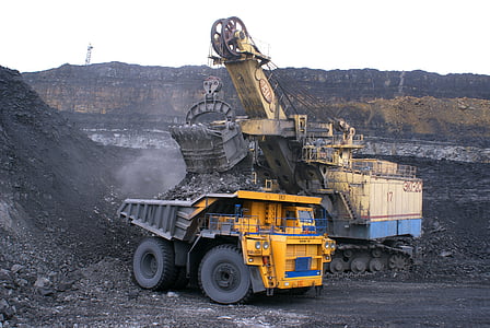 yellow dump truck beside gray soil thumbnail
