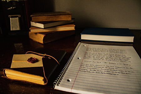 blue lined paper on black tabletop thumbnail