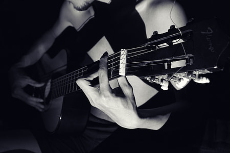 Closeup shot of a man playing a guitar thumbnail