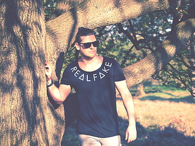 men lying on tree thumbnail