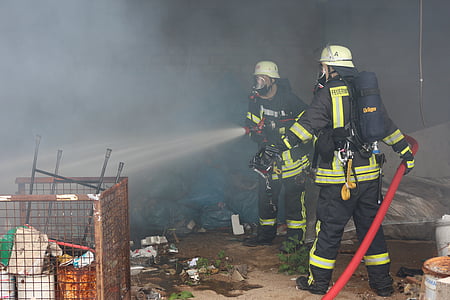fireman holding water hose thumbnail