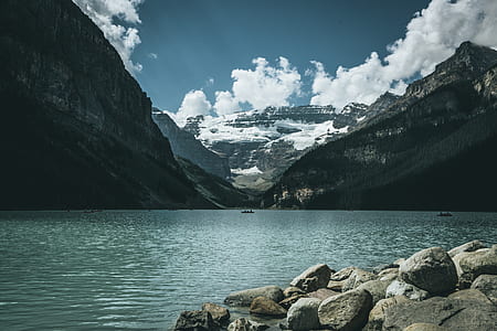 snow covered mountain, body of water and blue sky thumbnail