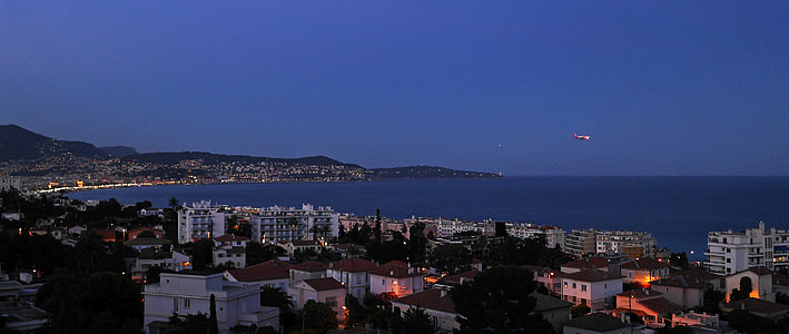 landscape photo of city near body of water thumbnail
