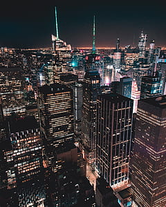 high angle photography of high-rise building at night time thumbnail