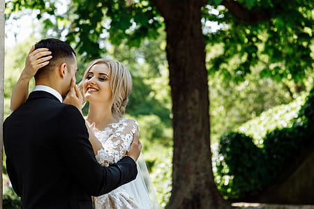 Couple Standing Under Tree thumbnail